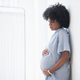 Black Woman holding Stomach